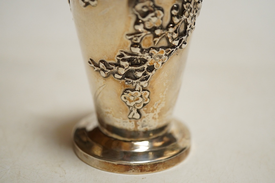 A Chinese export silver twin handed vase c.1900, stamped KC, artisans mark, decorated in relief with flowering prunus branches, height 13cm., weight approx. 4.72ozt
